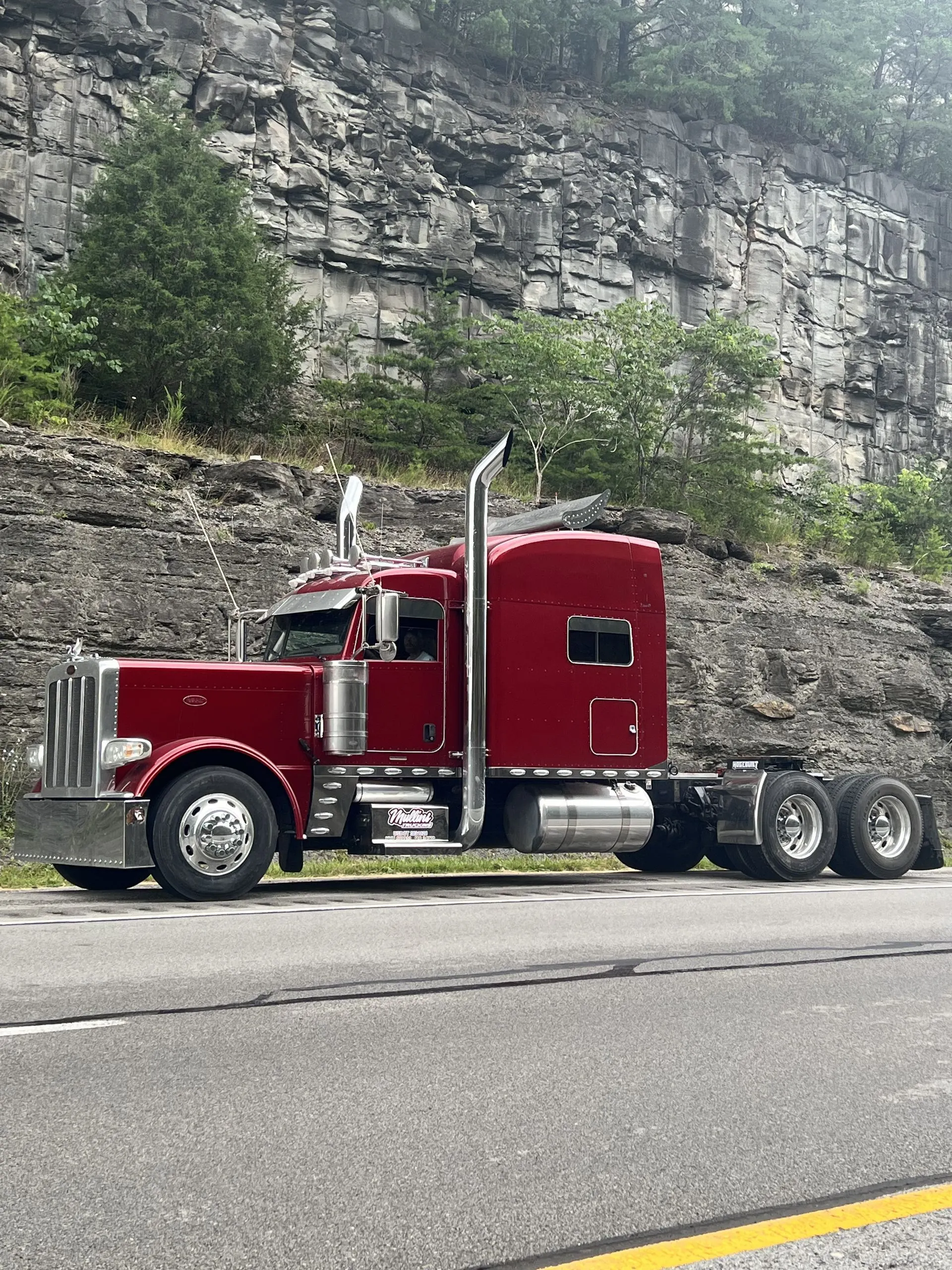 Mullins Trucking Peterbilt tractor running a Kentucky highway