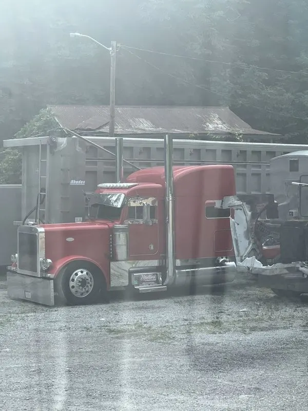 Red Mullins Trucking Peterbilt in early morning fog